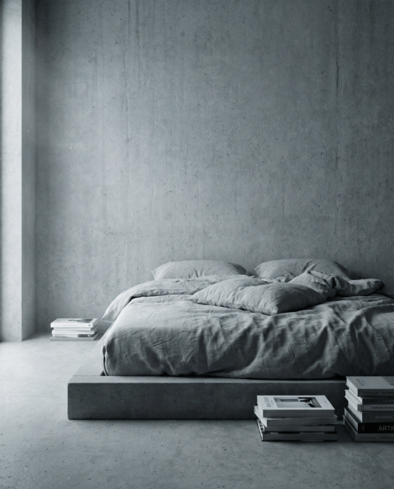 A low concrete bed dressed in soft grey linen, in a quiet room of bare concrete walls — the air after.
